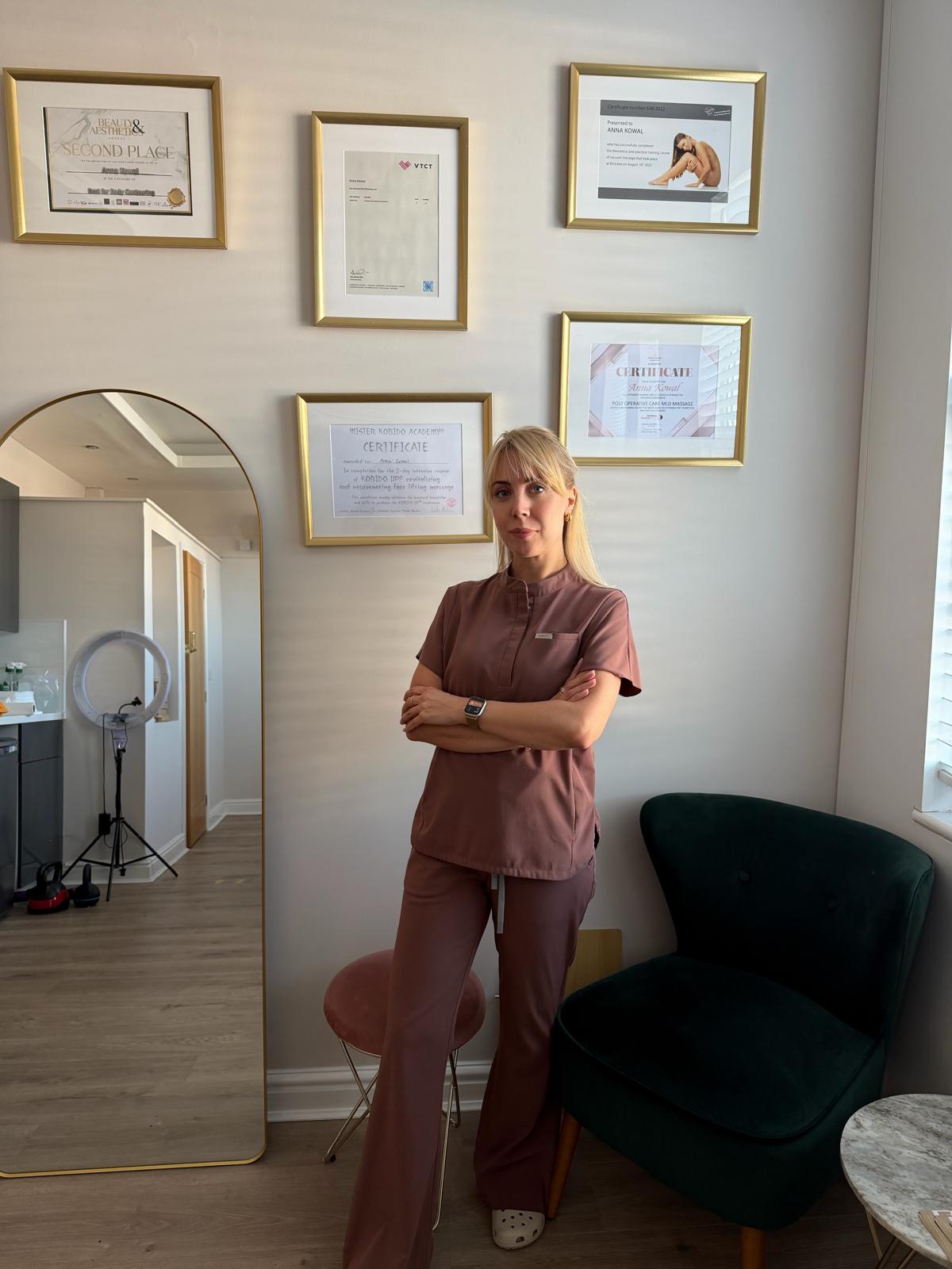 Anna Kowal, certified post-operative MLD specialist at Endermika Manchester, with her professional qualifications